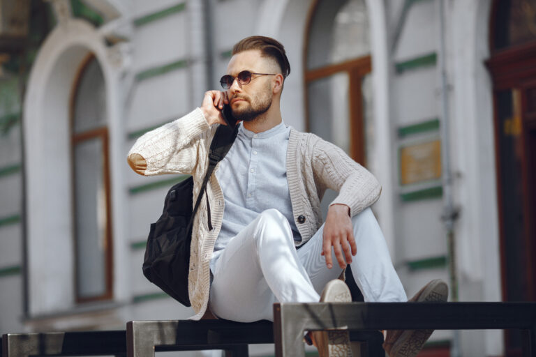 Man in a city. Businessman in a blue shirt.