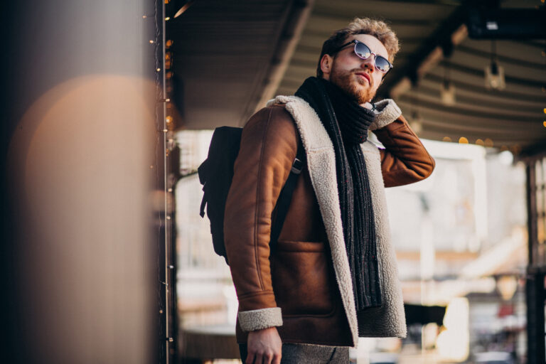 Young handsome man travelling at winter time